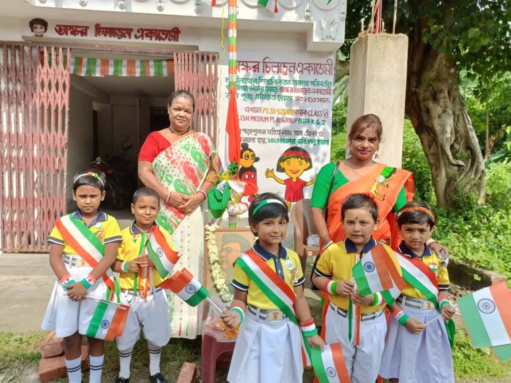 Students and teachers gathered outside the school for the Independence Day celebration